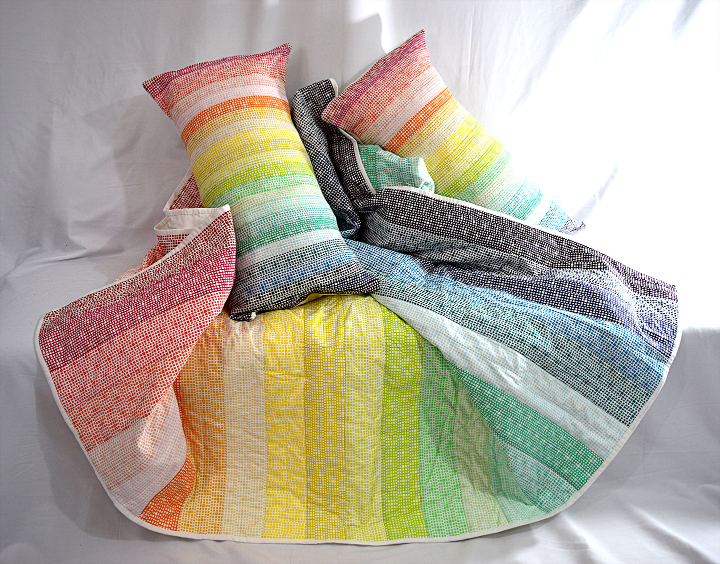 aggressively cheerful rainbow quilts