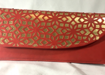 cut-leather accordion clutch