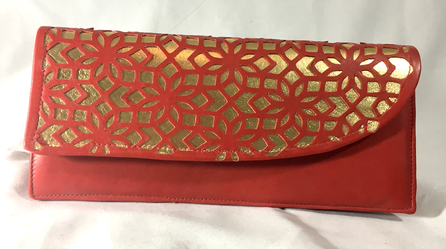 cut-leather accordion clutch